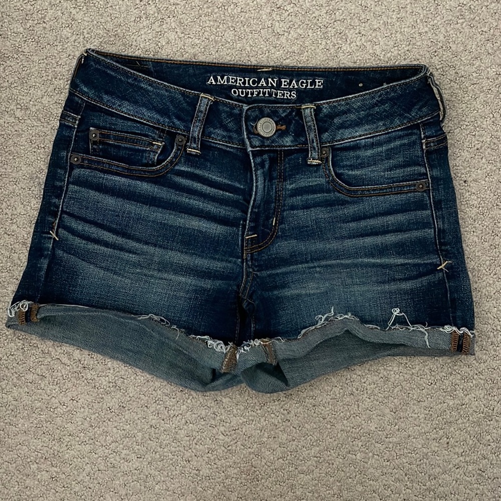 American Eagle distressed denim with frayed hem, size 4